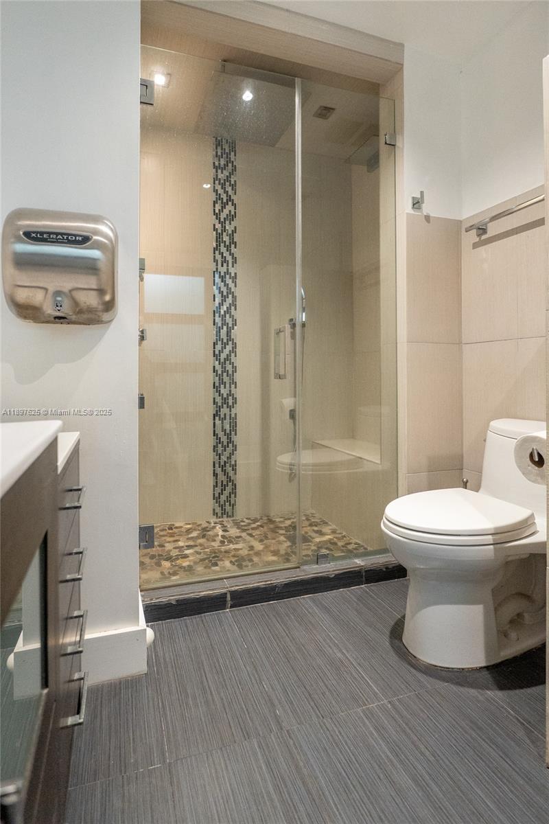 11851 Northwest 7th Street Plantation, FL 33325 - Photo 25 of 72 a bathroom with a toilet and a shower