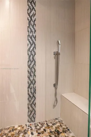 a bathroom with a table and a shower