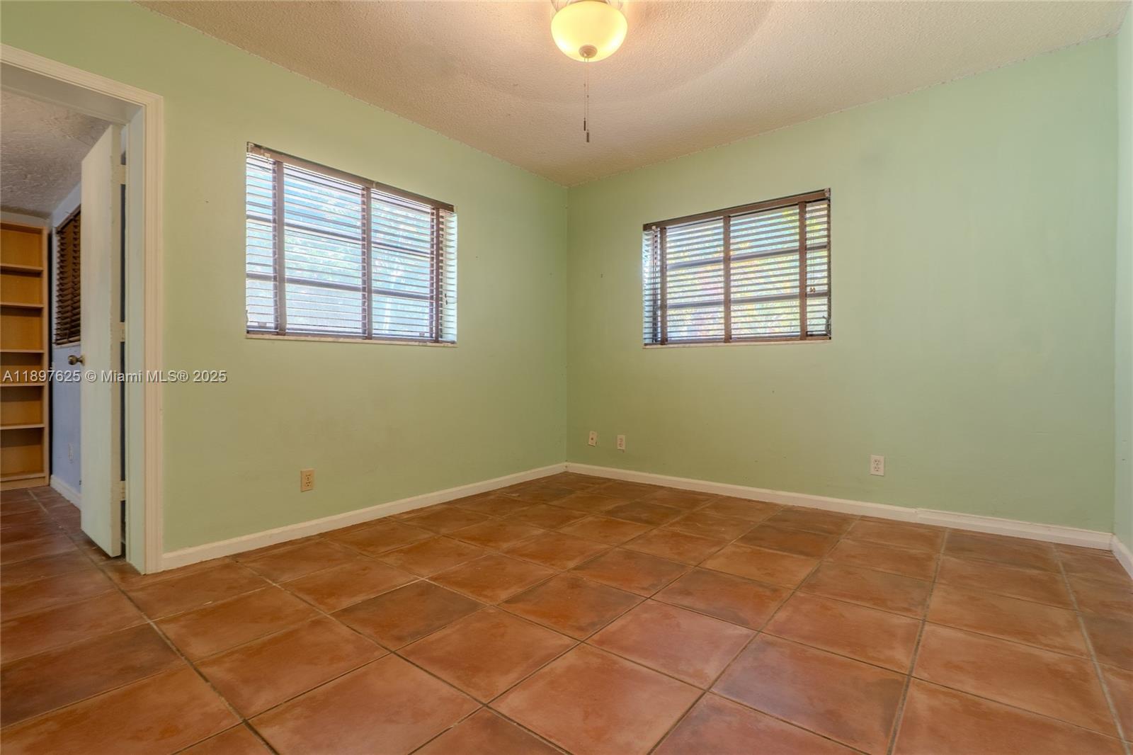 11851 Northwest 7th Street Plantation, FL 33325 - Photo 28 of 72 an empty room with windows
