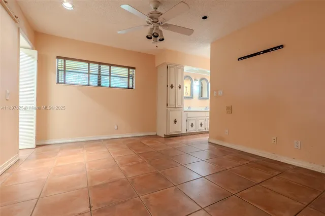a hallway with sliding door and yard in back