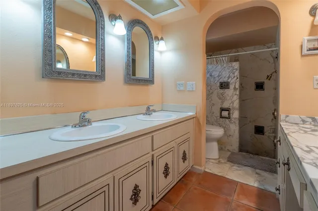 a kitchen with stainless steel appliances cabinets a sink and a window