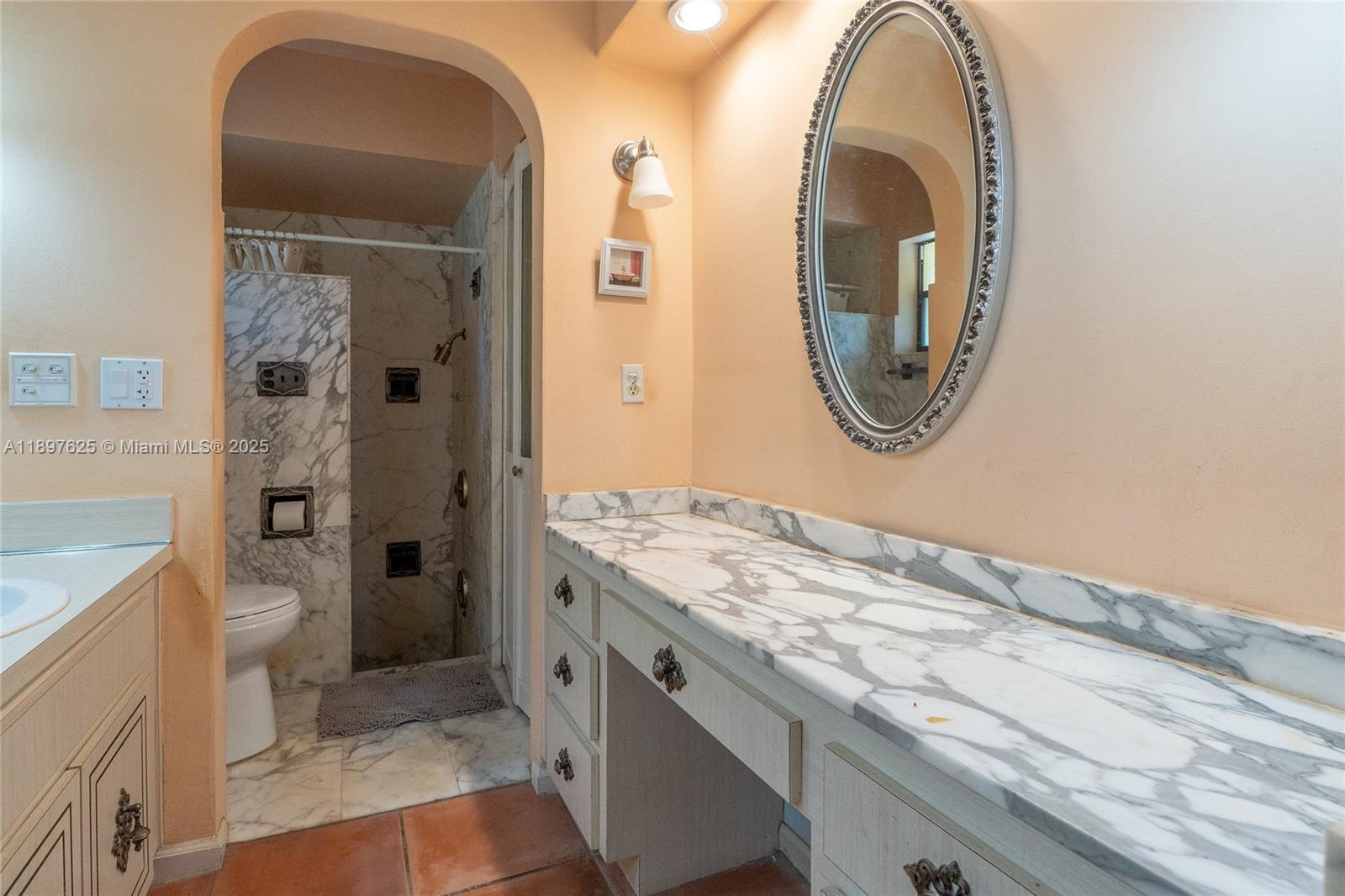 11851 Northwest 7th Street Plantation, FL 33325 - Photo 35 of 72 a bathroom with a granite countertop toilet a sink and a mirror