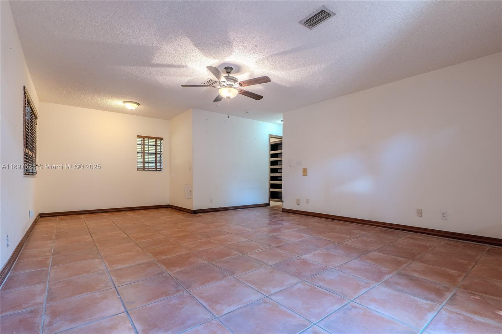 11851 Northwest 7th Street Plantation, FL 33325 - Photo 37 of 72 an empty room with windows and fan