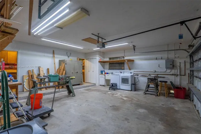 a view of a park with plants and large trees