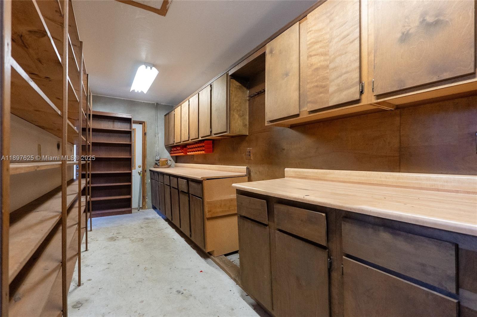11851 Northwest 7th Street Plantation, FL 33325 - Photo 48 of 72 a kitchen with stainless steel appliances cabinets a sink and a window