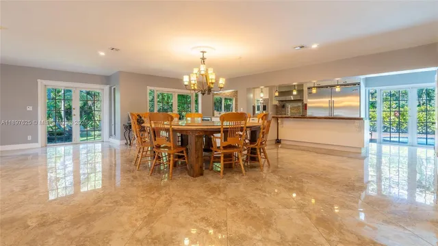a spacious bathroom with a granite countertop sink and a mirror