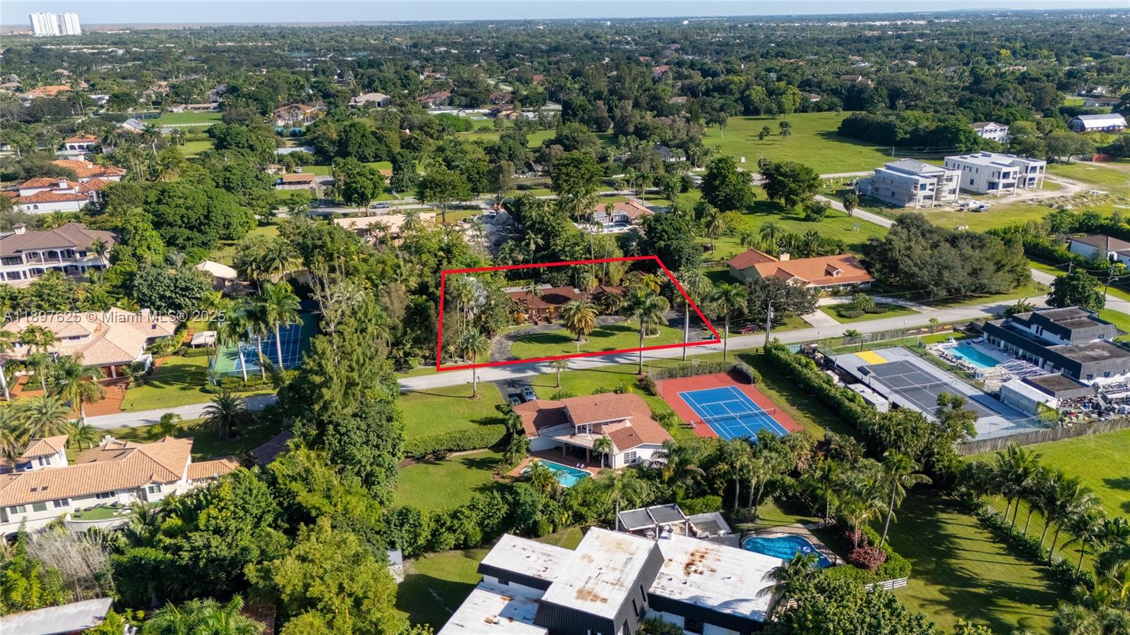 11851 Northwest 7th Street Plantation, FL 33325 - Photo 72 of 72 an aerial view of residential houses with outdoor space and trees