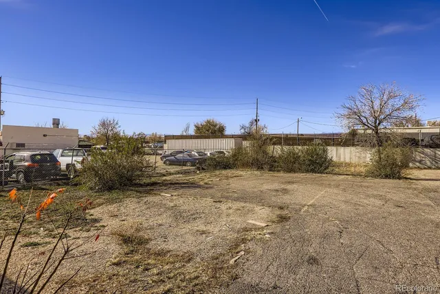 a view of a field with trees