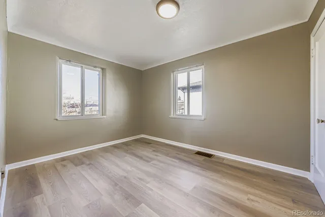 an empty room with windows