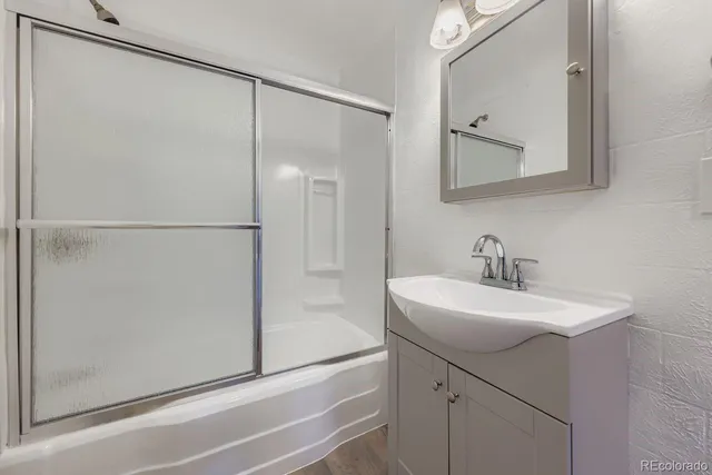 a bathroom with a sink and mirror