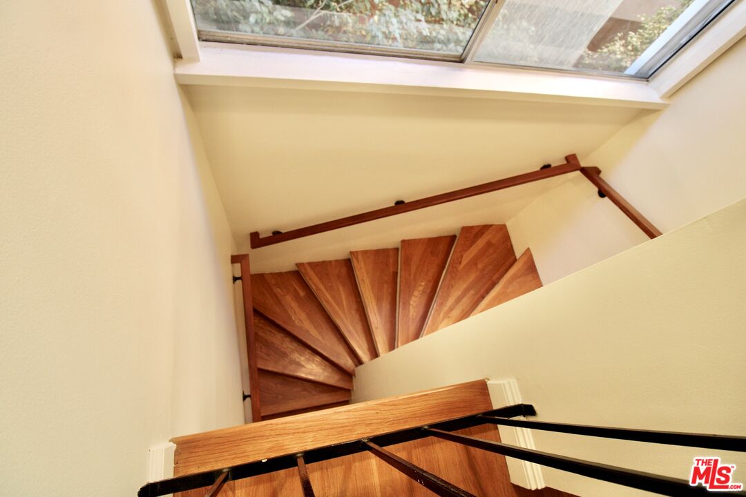 1825 Thayer Avenue Los Angeles, CA 90025 - Photo 15 of 38 a view of staircase with wooden floor and walls