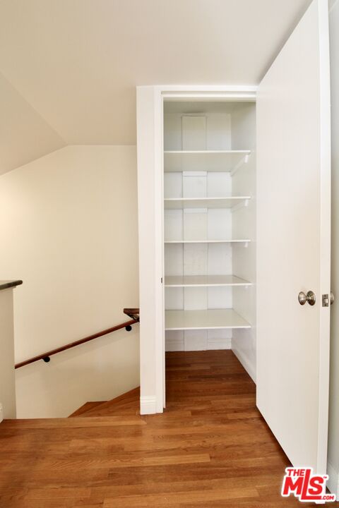 1825 Thayer Avenue Los Angeles, CA 90025 - Photo 16 of 38 a view of an empty room with wooden floor