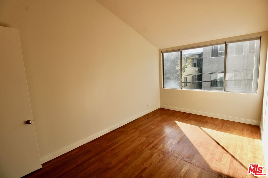 1825 Thayer Avenue Los Angeles, CA 90025 - Photo 18 of 38 a view of an empty room with a window