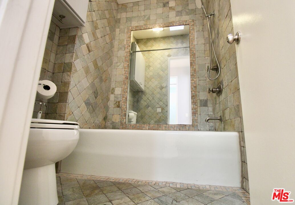 1825 Thayer Avenue Los Angeles, CA 90025 - Photo 27 of 38 a bathroom with a bathtub and shower