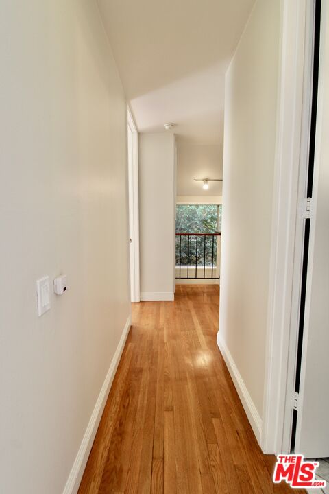 1825 Thayer Avenue Los Angeles, CA 90025 - Photo 29 of 38 a view of hallway with wooden floor
