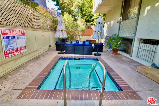 a view of a swimming pool with a patio