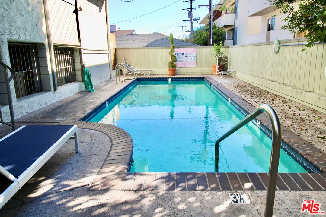 1825 Thayer Avenue Los Angeles, CA 90025 - Photo 37 of 38 a view of a swimming pool with a patio