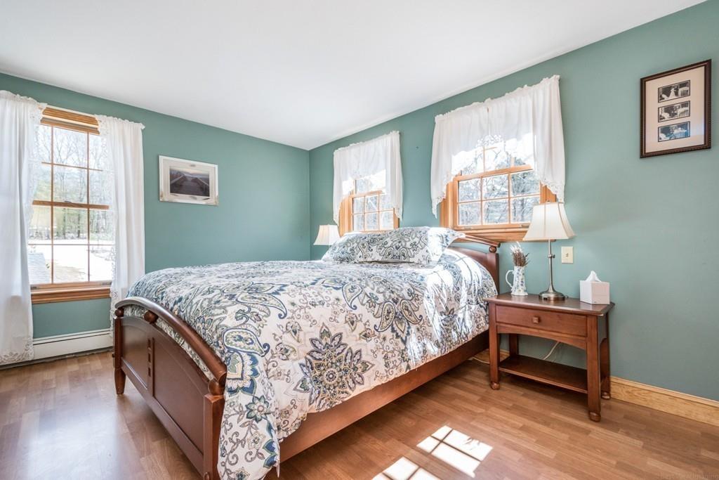16 South Shaker Road Harvard, MA 01451 - Photo 14 of 31 a bed sitting in a bedroom next to a window