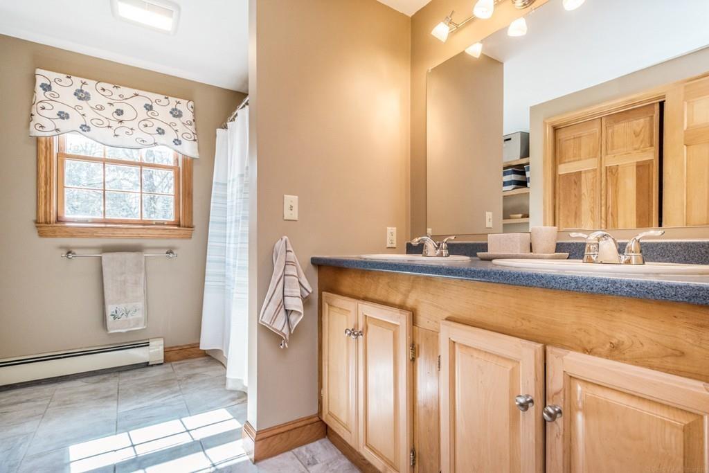 16 South Shaker Road Harvard, MA 01451 - Photo 16 of 31 a bathroom with a sink and a mirror