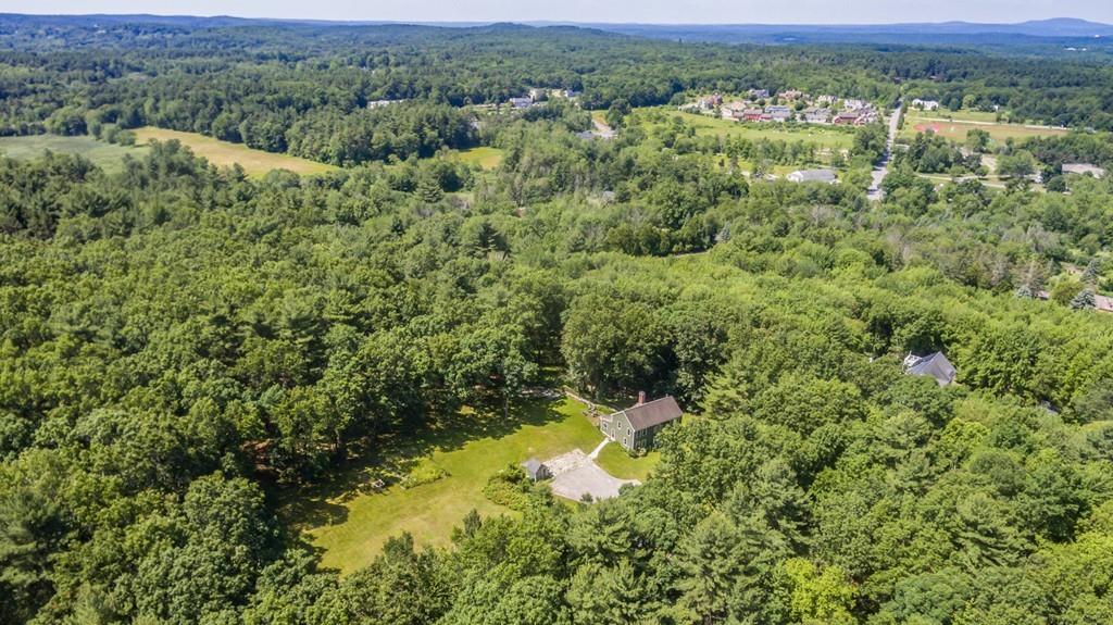 16 South Shaker Road Harvard, MA 01451 - Photo 30 of 31 a view of a lush green forest with trees and some houses
