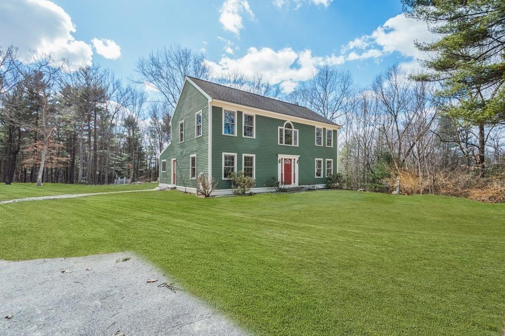 16 South Shaker Road Harvard, MA 01451 - Photo 3 of 31 a front view of house with yard and green space
