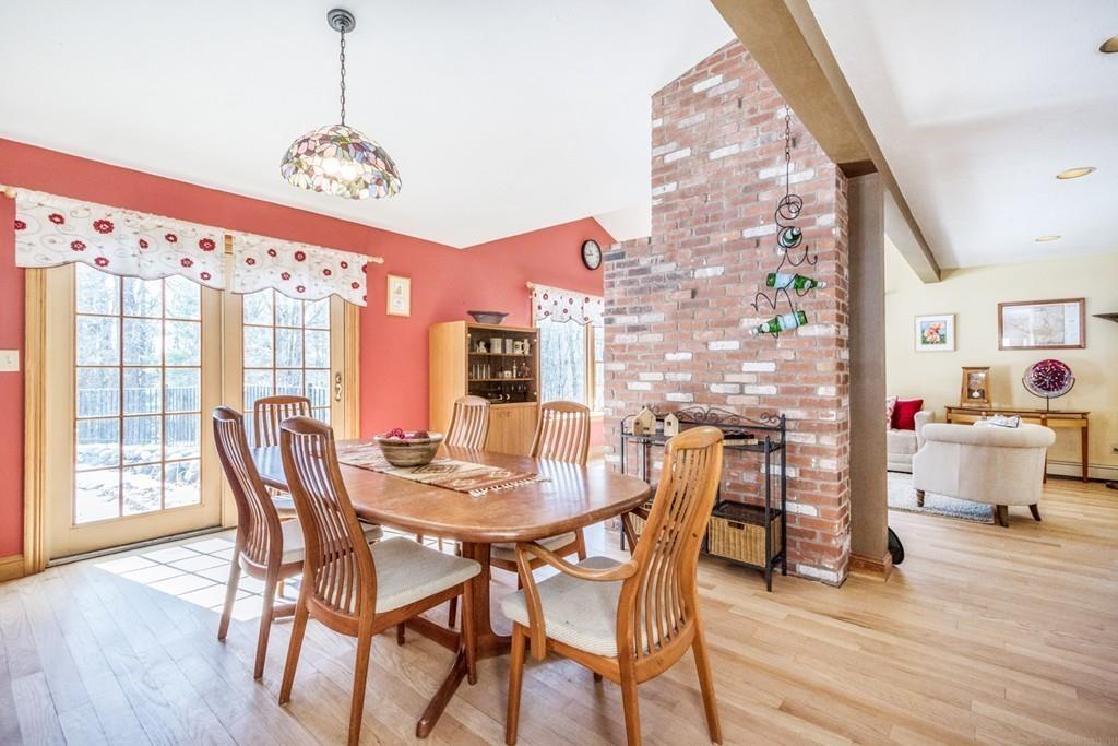 16 South Shaker Road Harvard, MA 01451 - Photo 7 of 31 a view of a dining room with furniture and chandelier