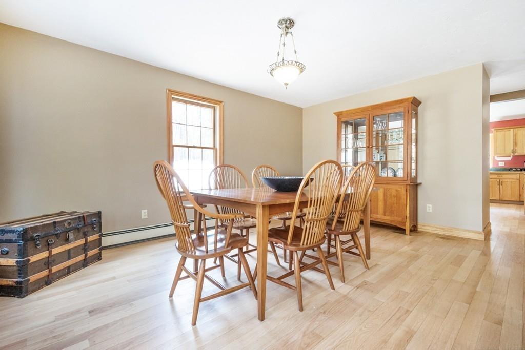 16 South Shaker Road Harvard, MA 01451 - Photo 10 of 31 a view of a dining room with furniture and wooden floor