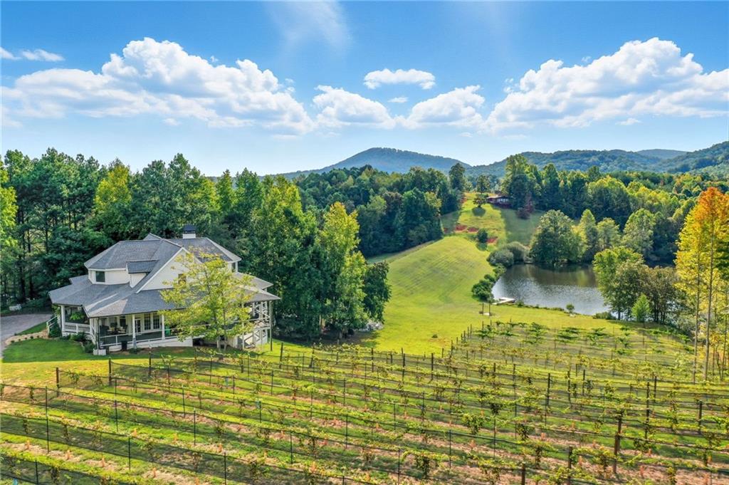 a view of a lake with a house in the background