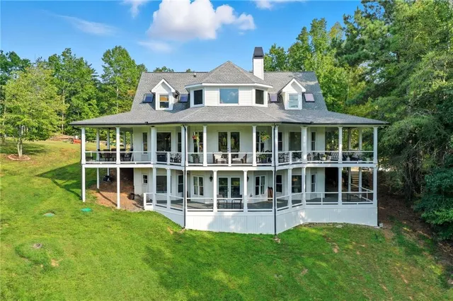 a view of a lush green hillside and houses
