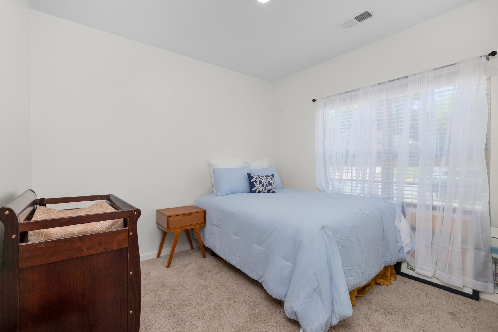 5132 Shellback Drive Millington, TN 38053 - Photo 17 of 24 a bedroom with a bed and a window