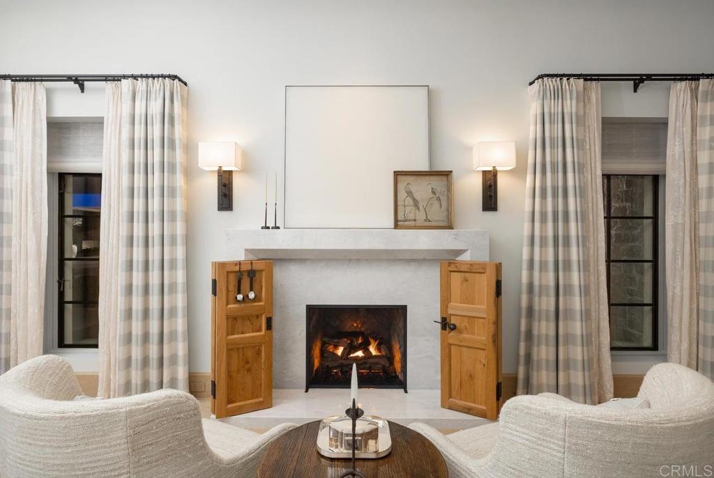 17845 Via De Fortuna Rancho Santa Fe, CA 92067 - Photo 13 of 20 a living room with furniture and a fireplace