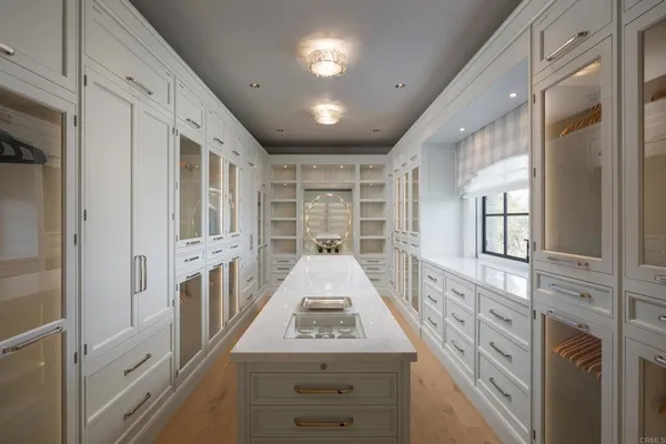 a living room with fireplace furniture and a large window