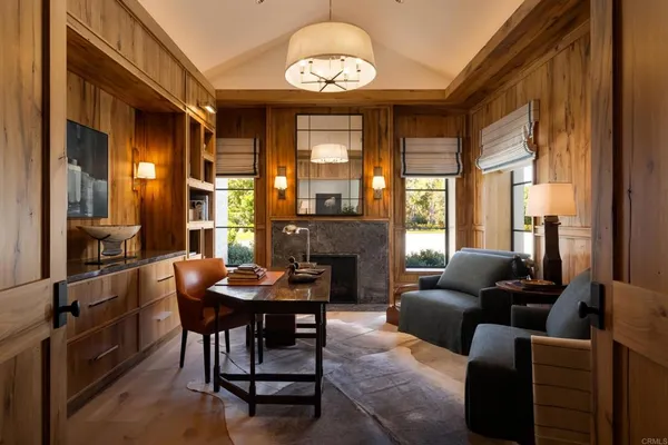 a bedroom with a bed and a table