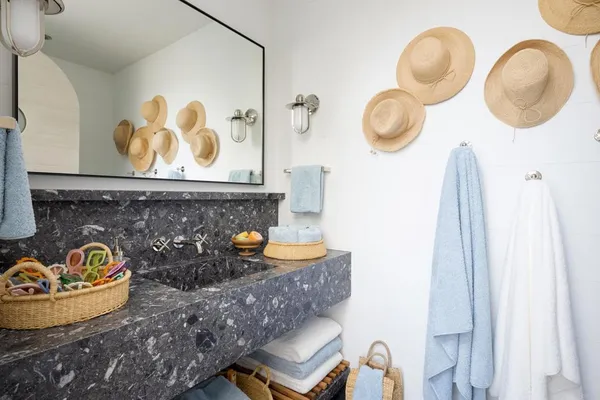 a view of a patio with table and chairs and potted plants
