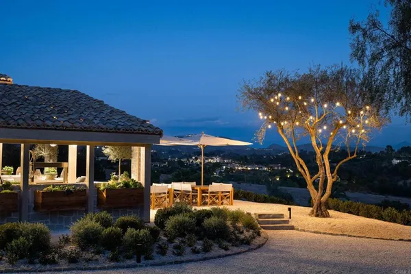 an aerial view of residential houses with outdoor space and swimming pool