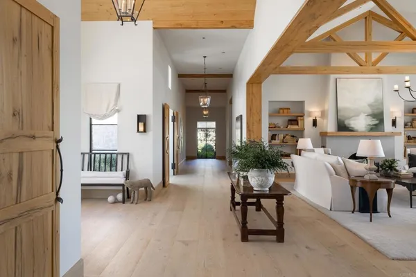 a dining room with furniture and wooden floor