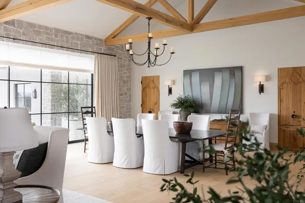 a dining room with furniture and wooden floor