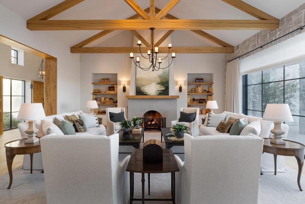 17845 Via De Fortuna Rancho Santa Fe, CA 92067 - Photo 6 of 20 a living room with furniture and a fireplace