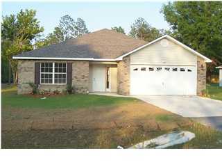 6109 Old Hickory Road Crestview, FL 32539 - Photo 1 of 2 a view of a house with a yard