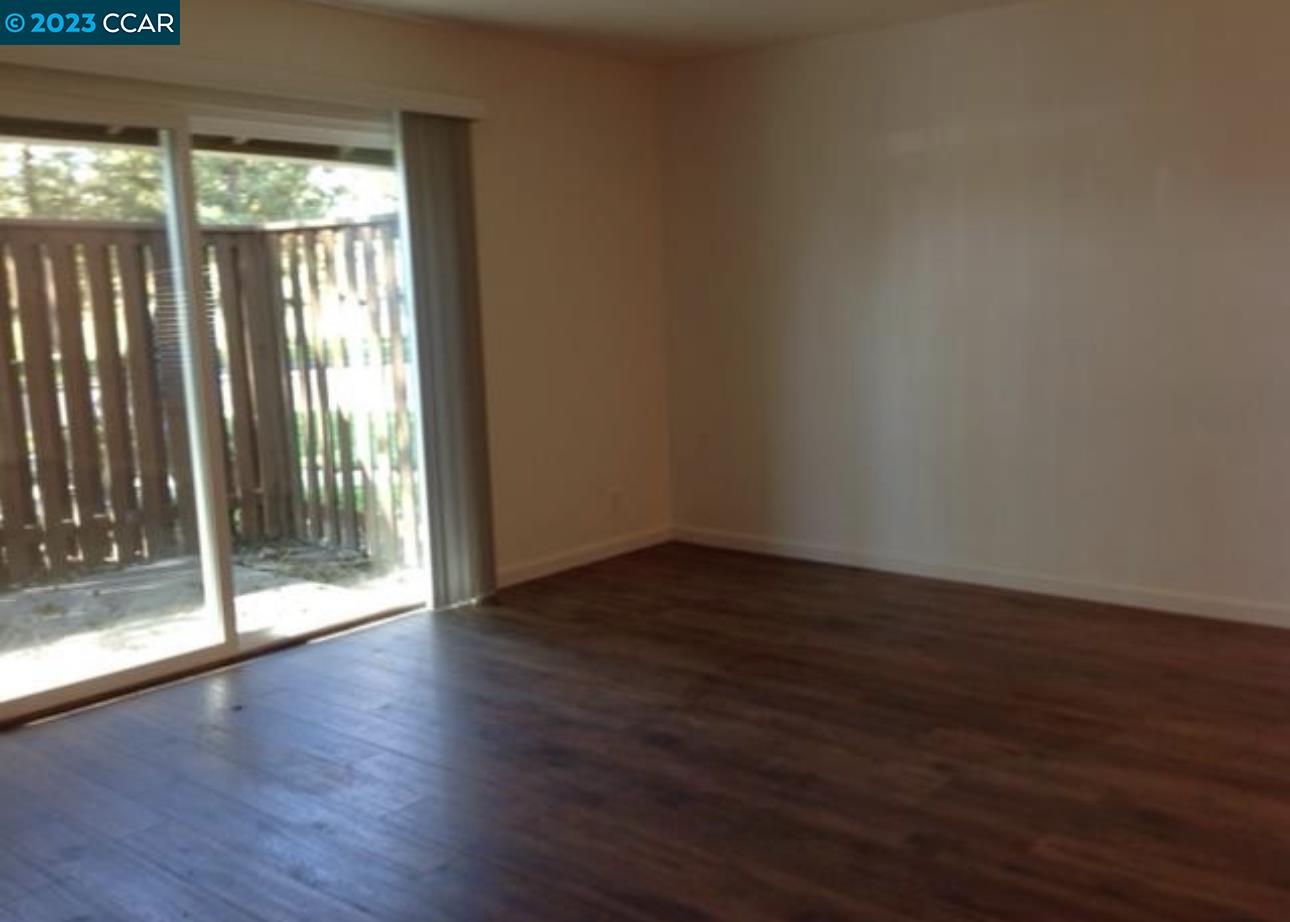 2019 Olivera Road, Unit B Concord, CA 94520 - Photo 2 of 7 a view of wooden floor and brick walls