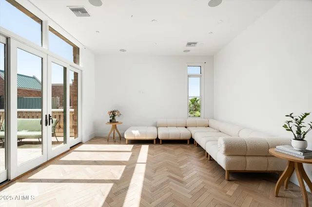 a living room with furniture and a rug