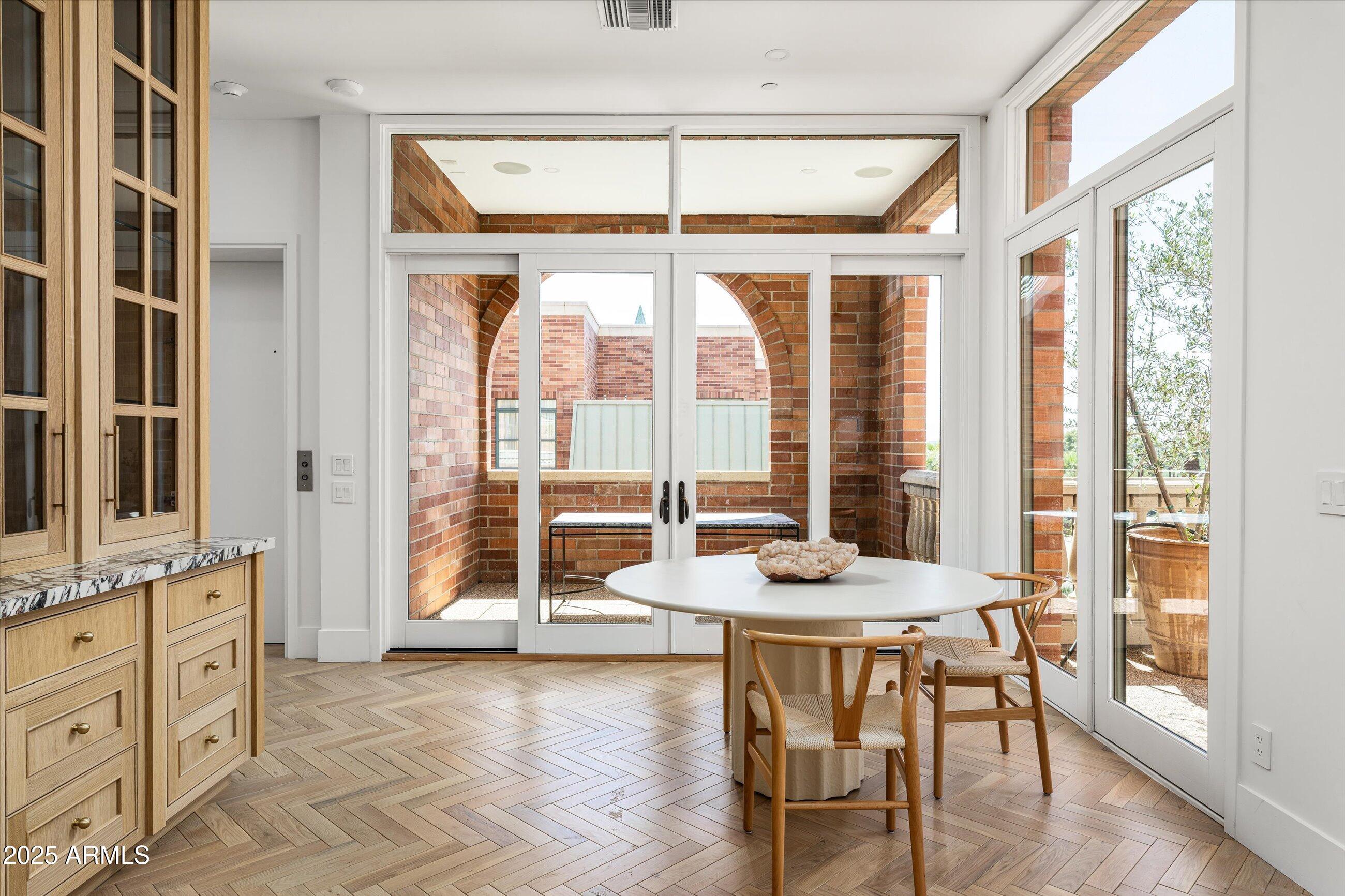 54 West Palm Lane, Unit 54 Phoenix, AZ 85004 - Photo 12 of 31 a living room with furniture and large windows