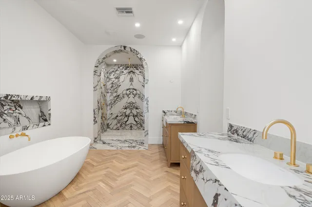 a bathroom with a bathtub sink and toilet