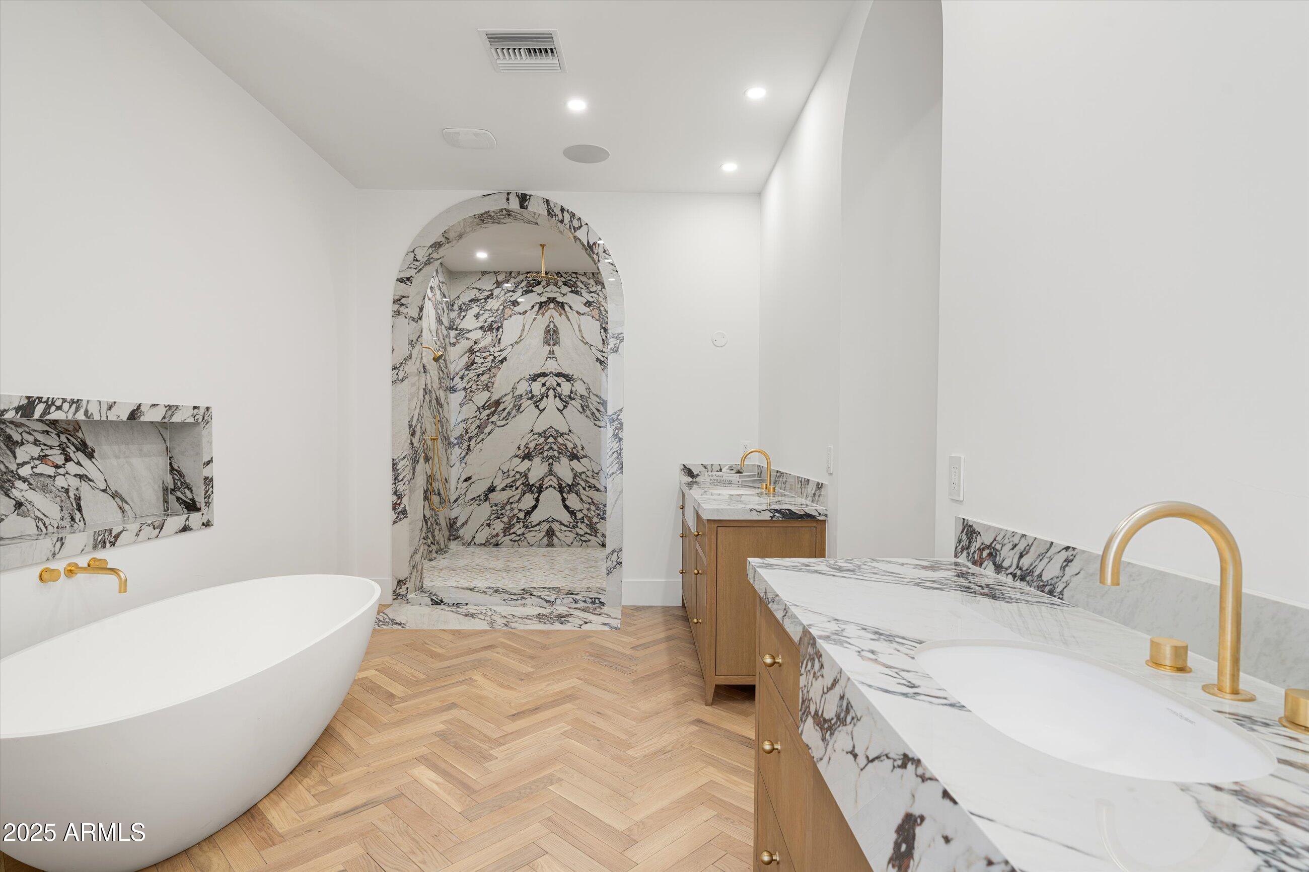 54 West Palm Lane, Unit 54 Phoenix, AZ 85004 - Photo 17 of 31 a bathroom with a bathtub sink and toilet