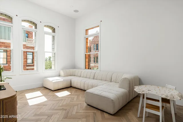 a living room with furniture and a window