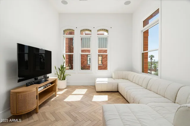 a living room with furniture and a flat screen tv