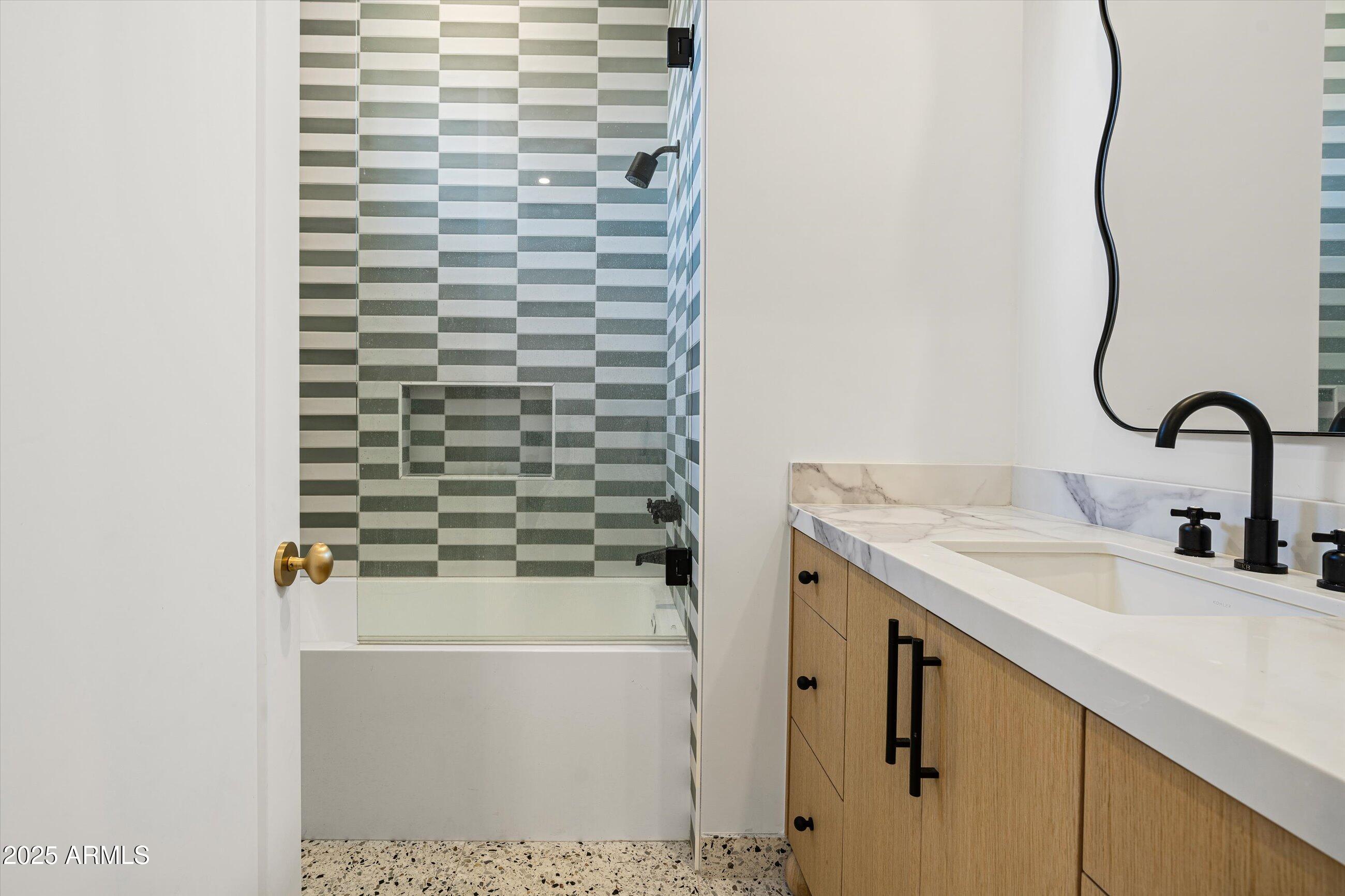 54 West Palm Lane, Unit 54 Phoenix, AZ 85004 - Photo 26 of 31 a bathroom with a sink and a mirror