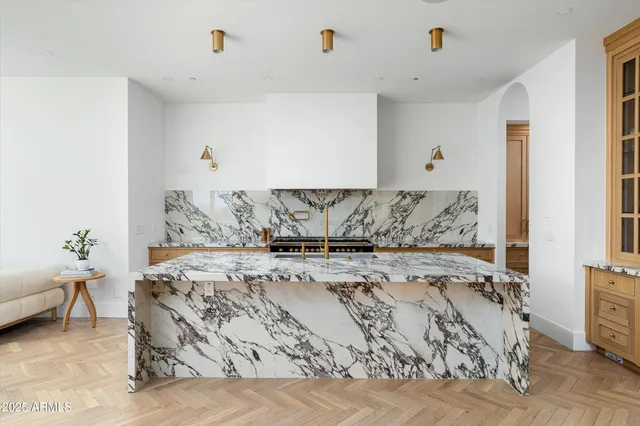 a bed sitting in a bedroom and furniture