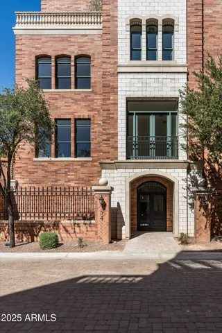 a front view of a house with a road