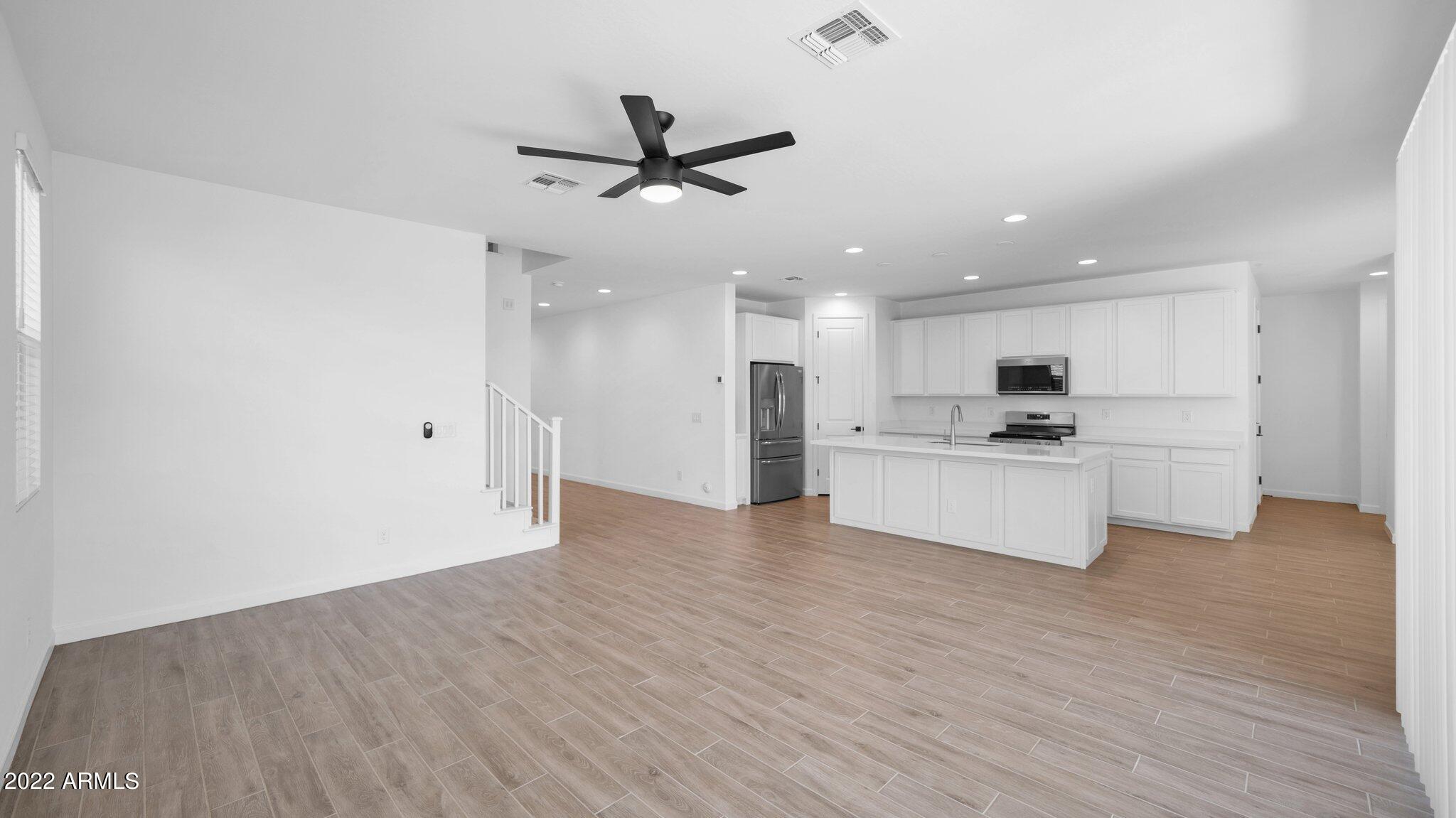 13407 West Rowel Road Peoria, AZ 85383 - Photo 34 of 52 Family Room Looking to Kitchen